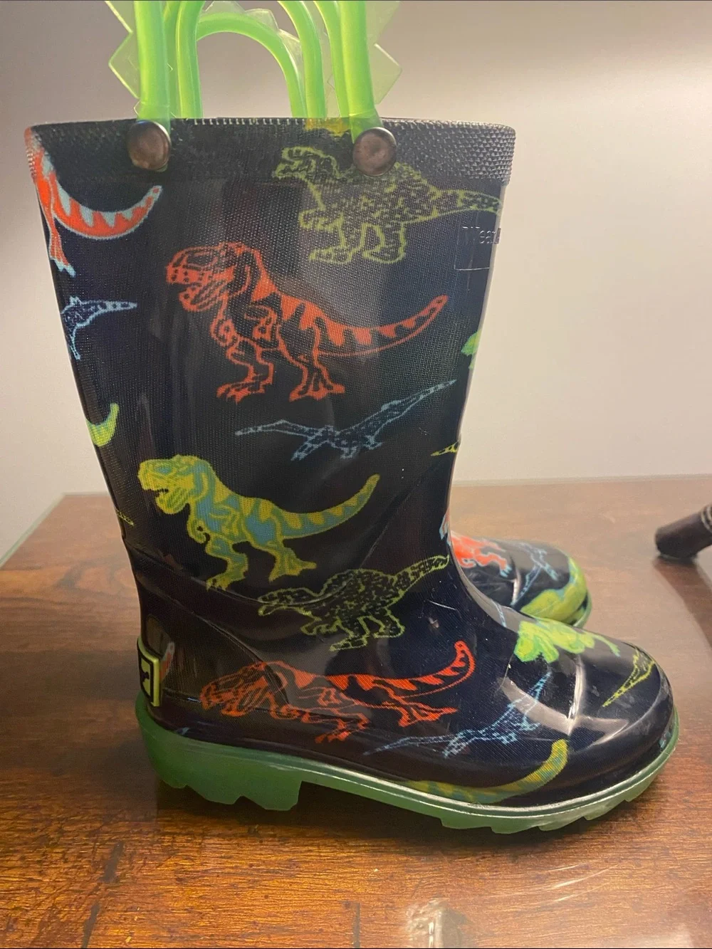Western Chief Kids Black Rain Boots with Neon Green Handles and Accent Dinosaurs